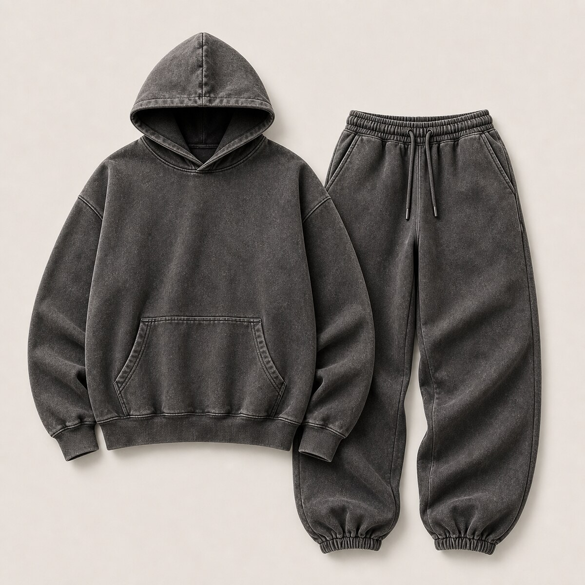 Dark matching hoodie and jogger reference laid out as a complete set
