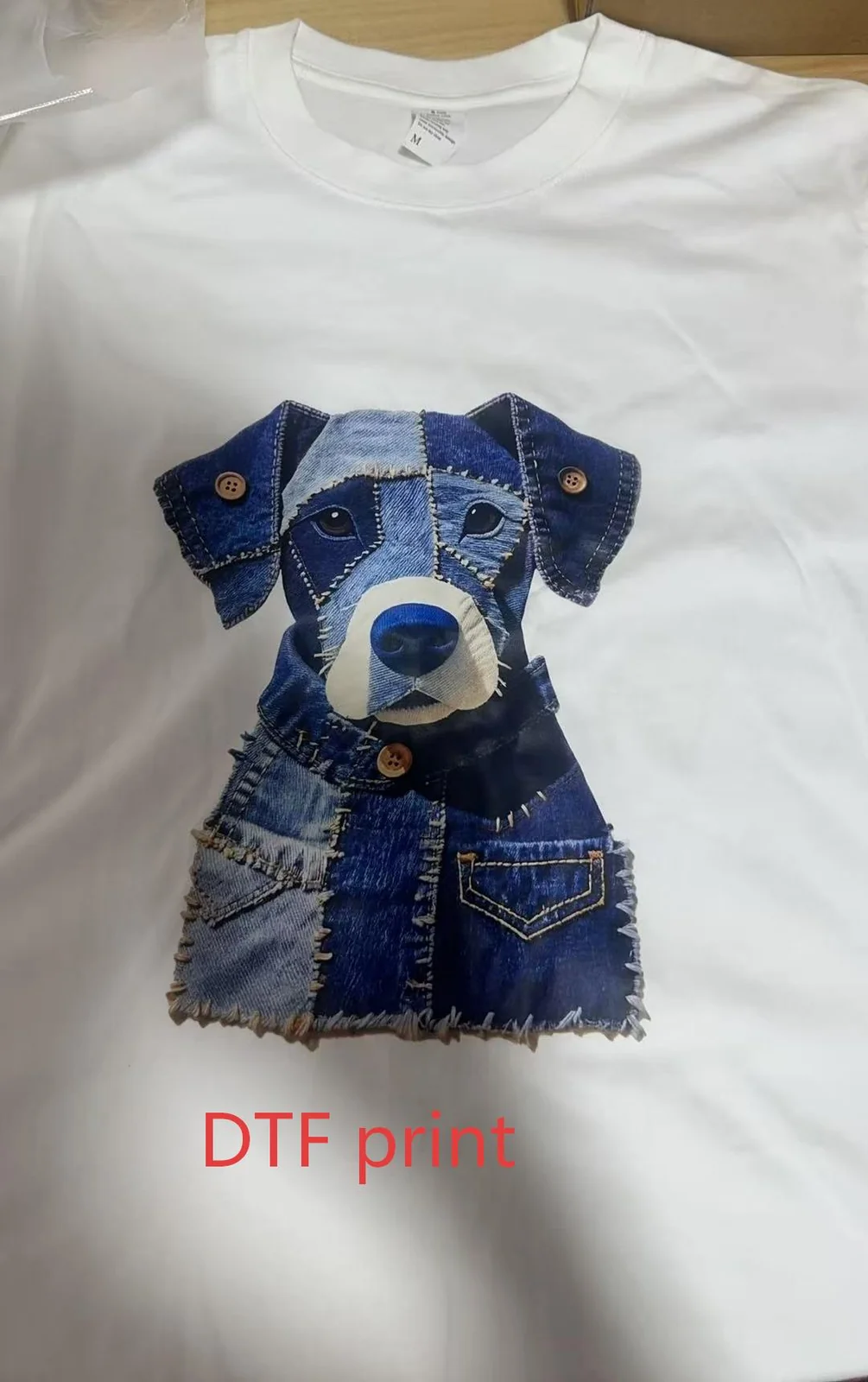 DTF print reference showing a detailed patchwork-style dog graphic on a white T-shirt