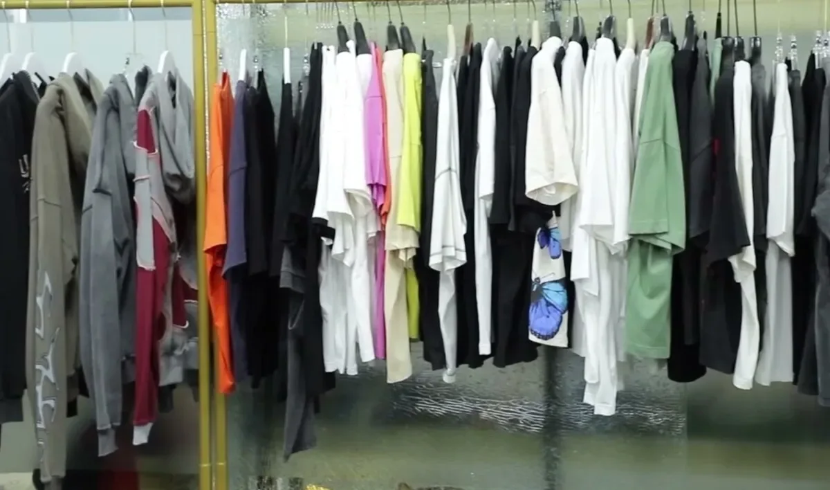 Rack of finished sample garments across several styles
