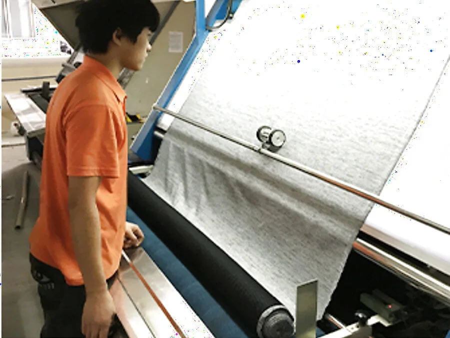 Fabric inspection equipment in a Jiashun workspace