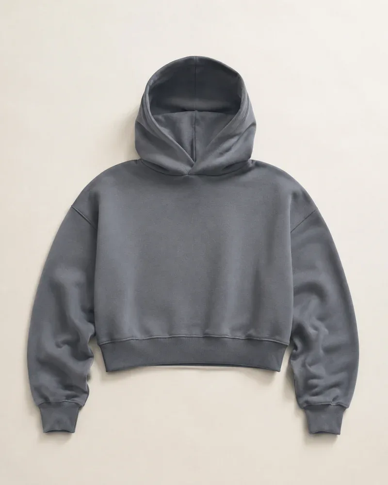 Slate-grey cropped hoodie design illustration with a shorter body and roomy sleeves