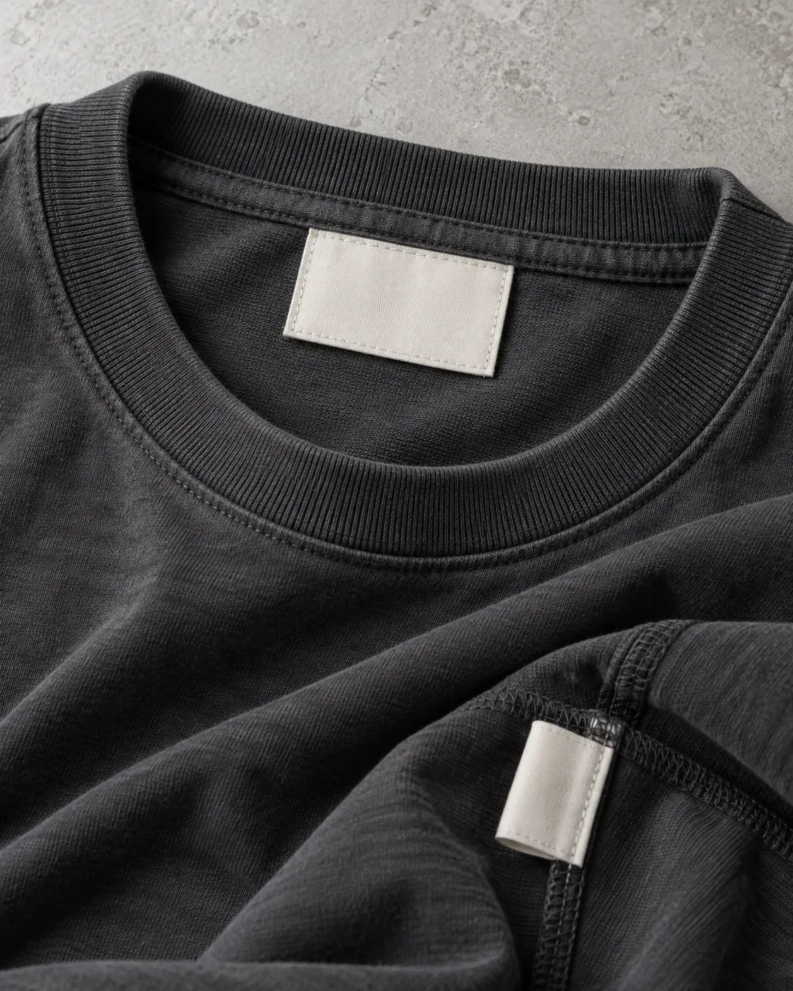 Plain woven neck label and care label sewn into a heavyweight garment