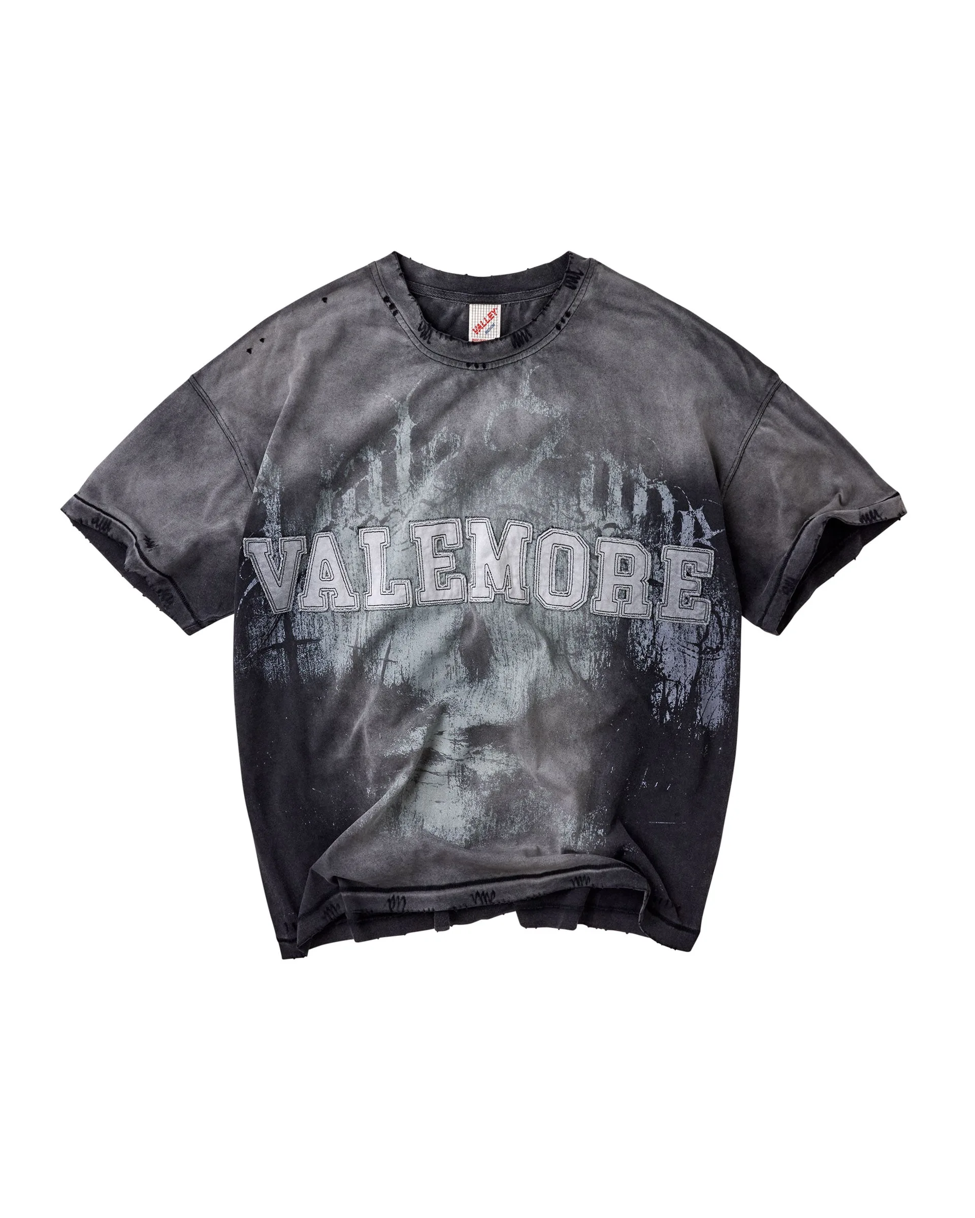 Washed dark T-shirt with grey Valemore appliqué lettering over a forest graphic