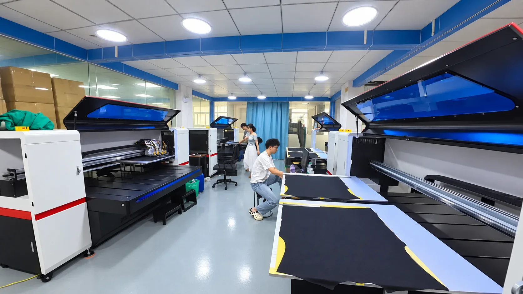 Printing workshop with print tables and sample garments